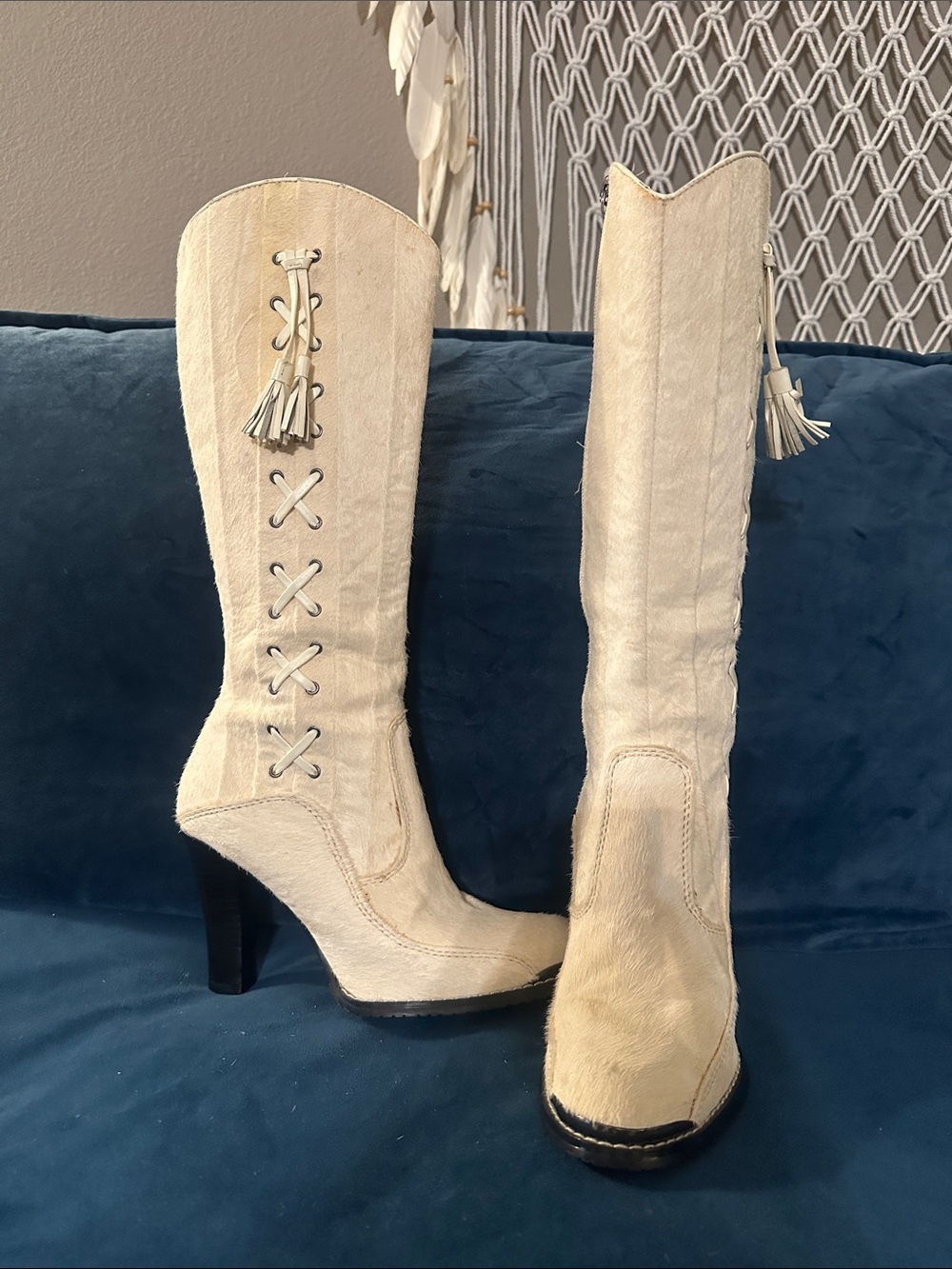 Donald J. Pliner Anita boots in white/ivory haircalf leather.